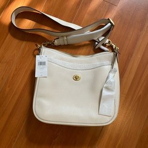 Coach leather adjustable crossbody bag NWT! Color is chalk, elegant!